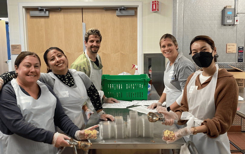Volunteers packing meals.