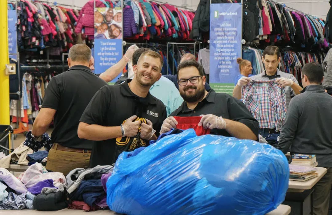 Volunteers sorting donated clothing