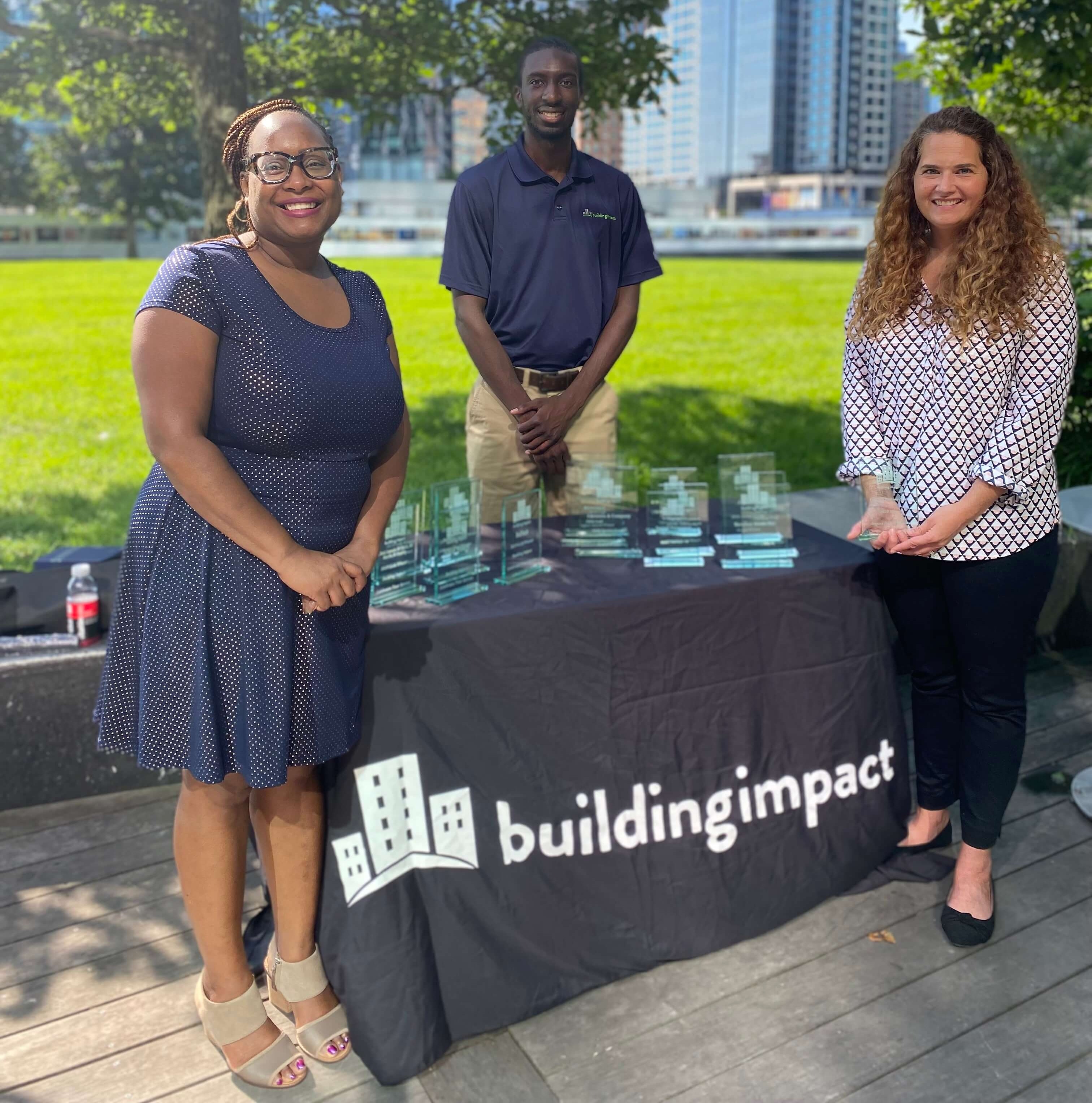Commercial Real Estate Partners stand with their BI Impact Award.