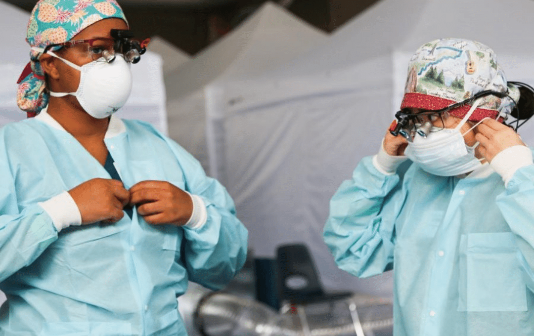 Two medical professionals at a pop up medical station.