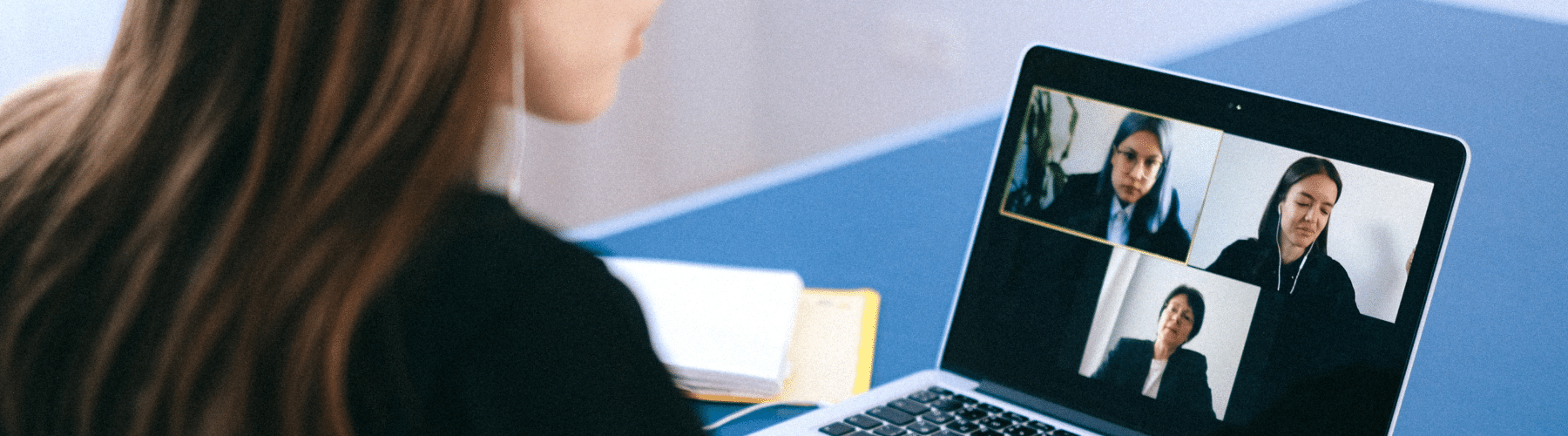 A young person meets with professionals online during a skills-based volunteering session to learn more about possible career paths.